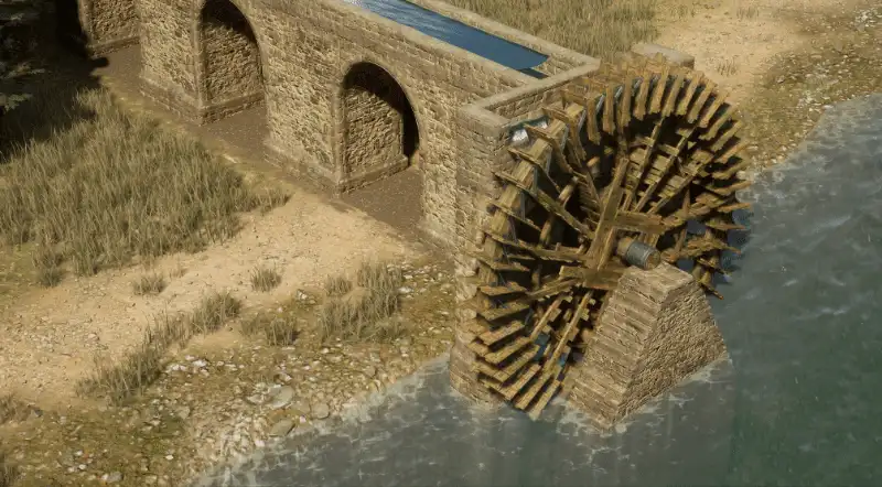 Une pompe à eau en fonctionnement au bord d'un cours d'eau